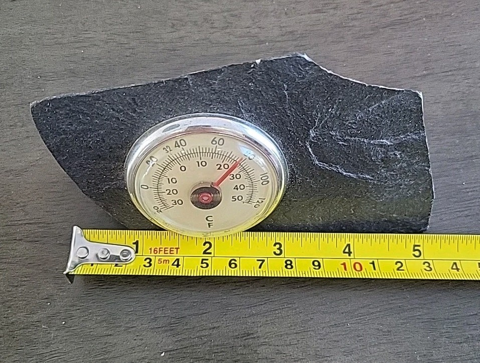 Vintage Desktop Thermometer on Jagged Stone.