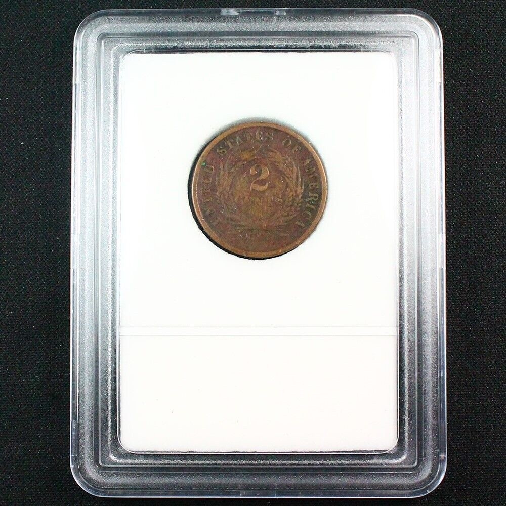 One Slabbed U.S. Two Cent Piece dated between 1864 - 1873