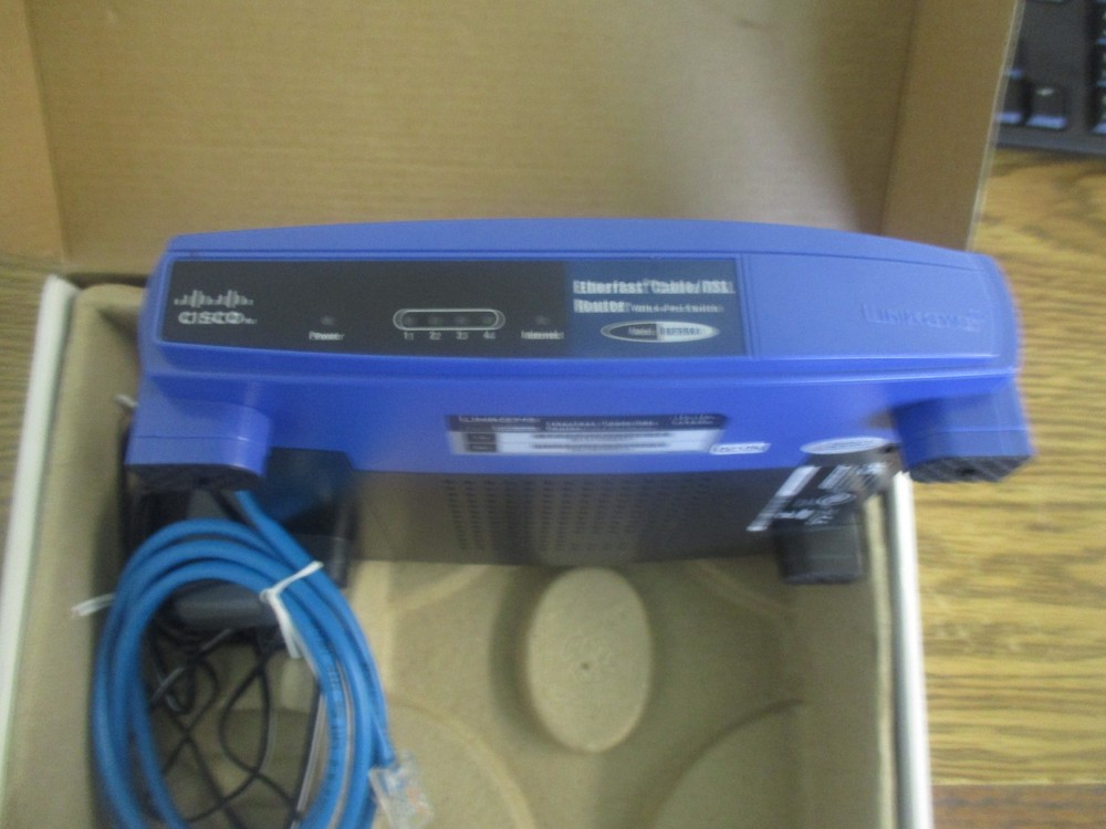 Linksys: BEFSR41 Ethernet Cable/DSL Router with 4-Port Switch. Includes Adptr