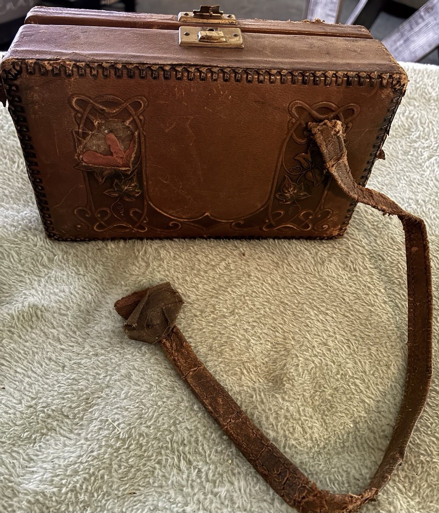 Antique leather-bound etui or traveling caddy set