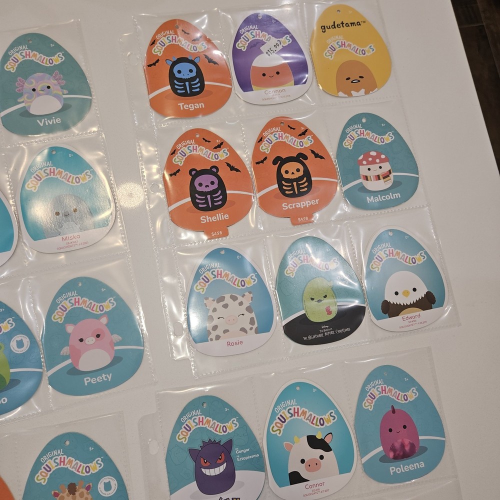 71 Squishmellow Tags In Binder. TAGS ONLY
