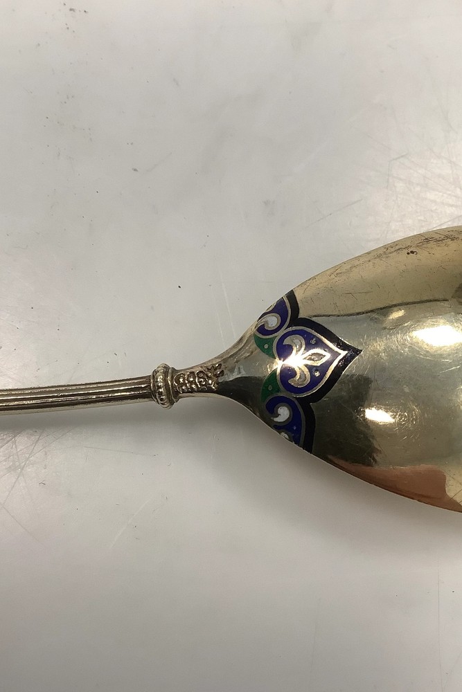 Silver spoon with enamel ornamentation and gilding