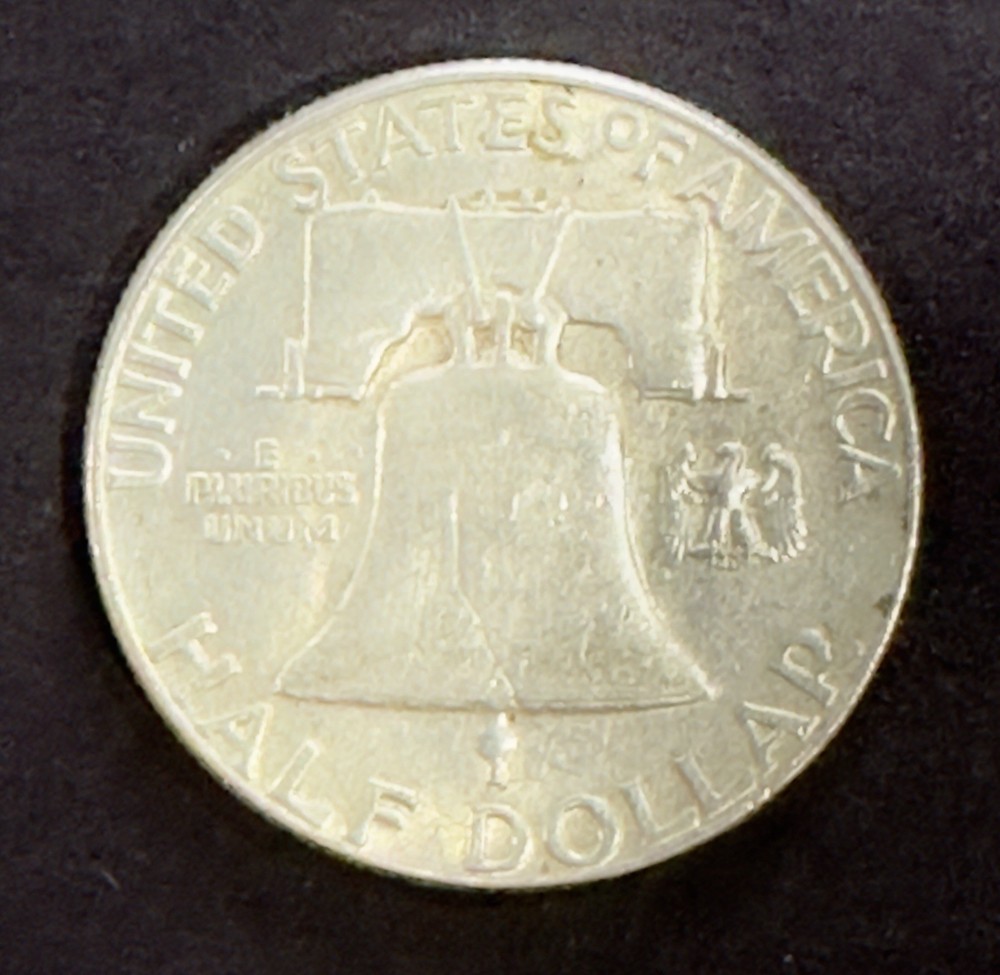 1955-P Franklin Half Dollar. Circulated. Fine. Obverse Bugs Bunny Error
