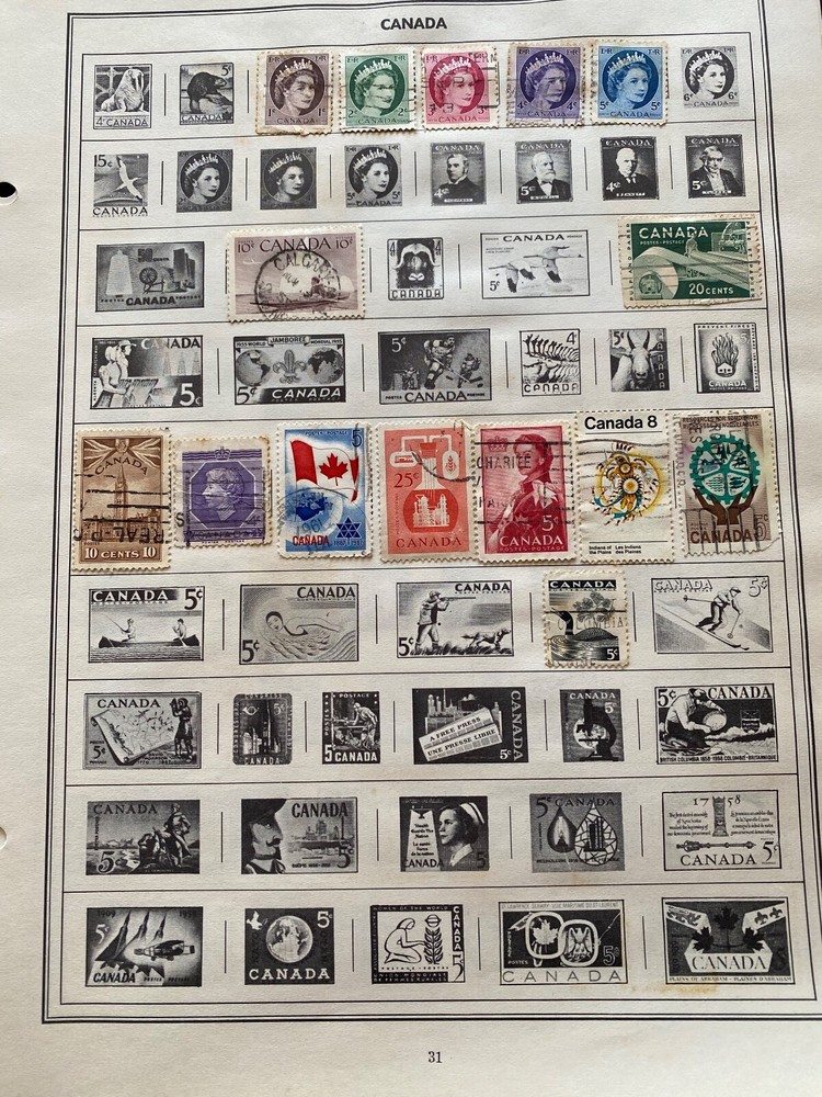 Worldwide Canada Stamps hinged on pages