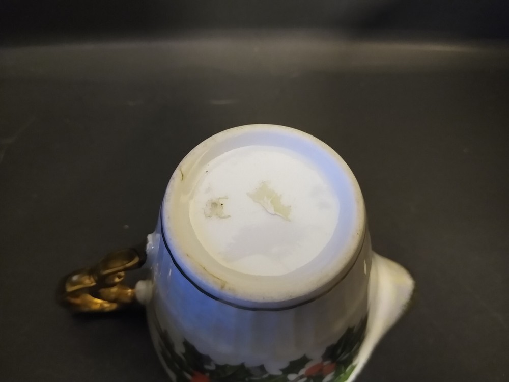 Iridescent Holly Creamer unknown maker; two small dark marks under glaze