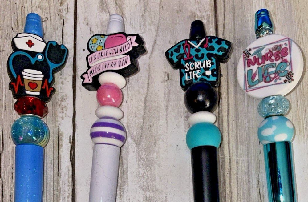 4 miscellaneous beaded pens with 1 ink refill each