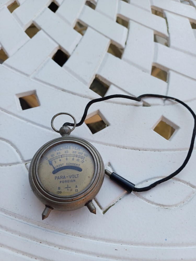 Vintage pocket watch style volt meter