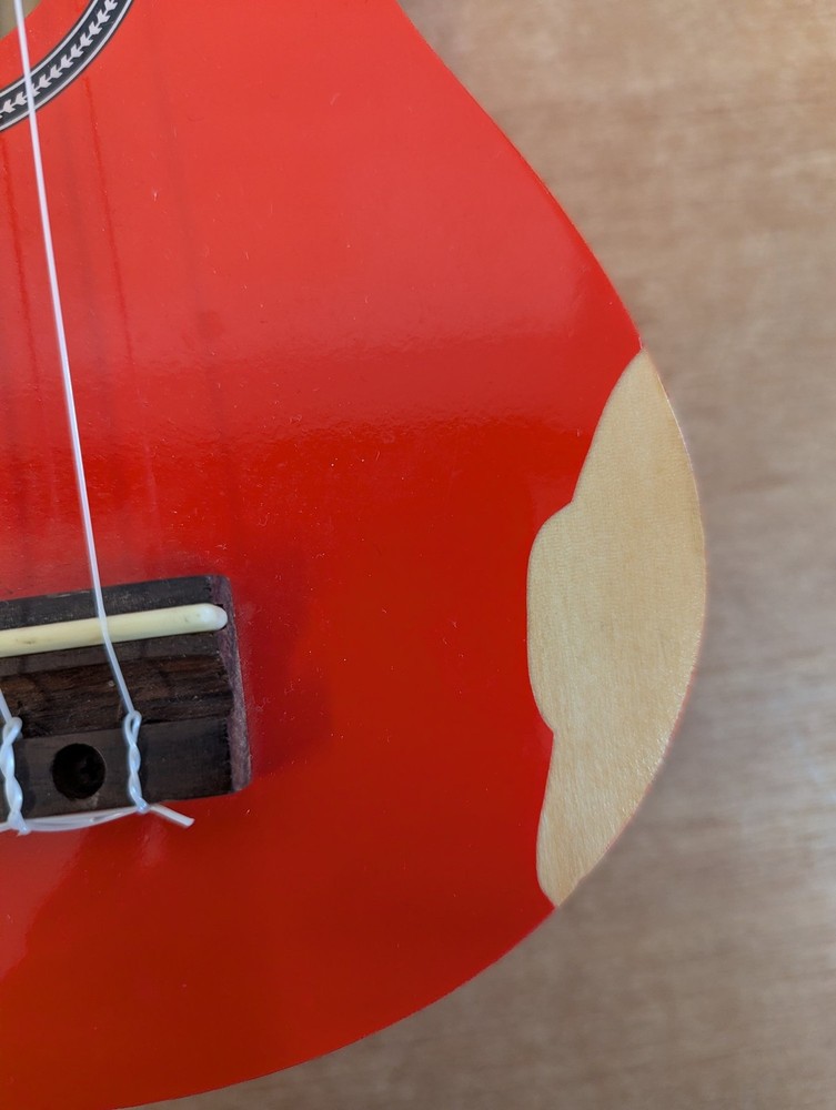 Octopus Soprano Ukulele Red with 4 Strings Includes Case for Beginners