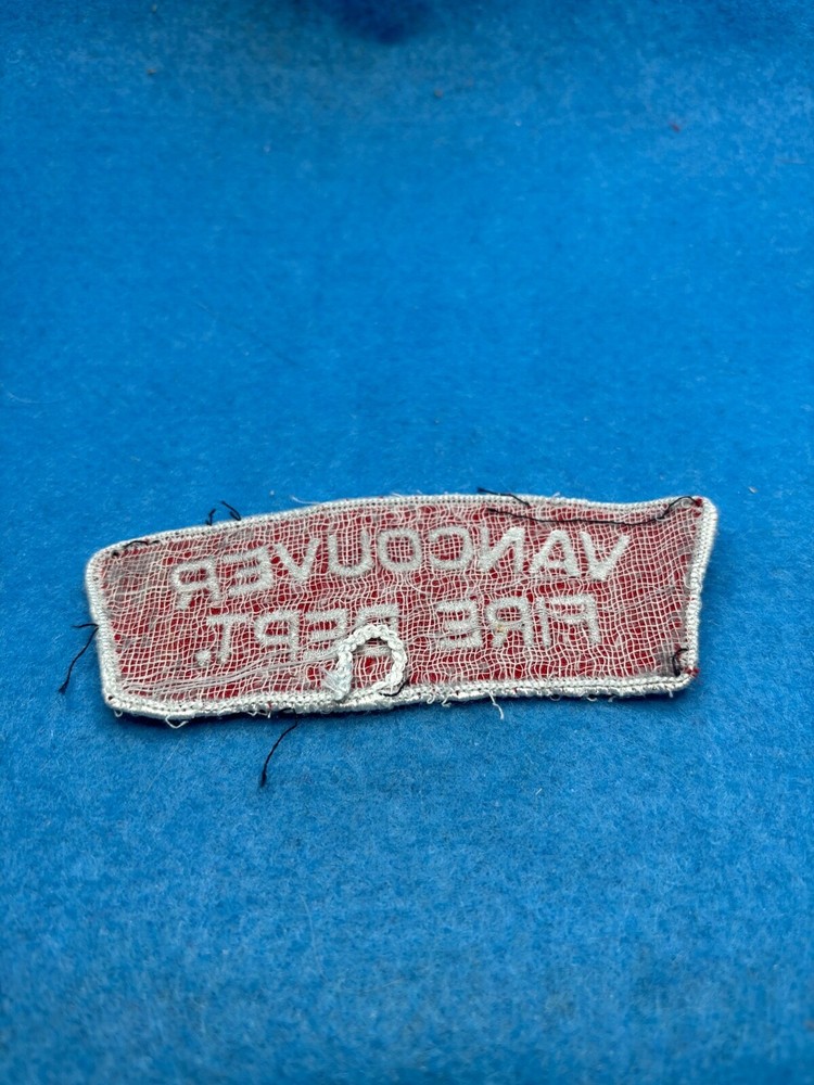 Shoulder Vancouver white lettering on red