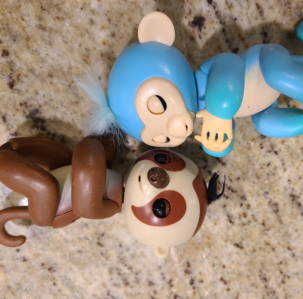 2 Fingerlings Interactive Baby Monkey Blue Brown Toys. Both work tested.