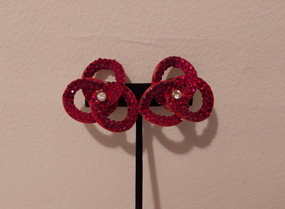red rhinestone linked intertwined loop statement clip earrings