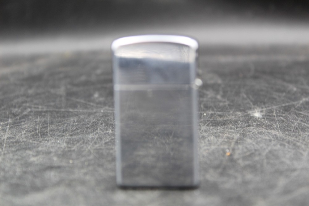 Zippo Lighter 2-1/4” X 1-1/8”.