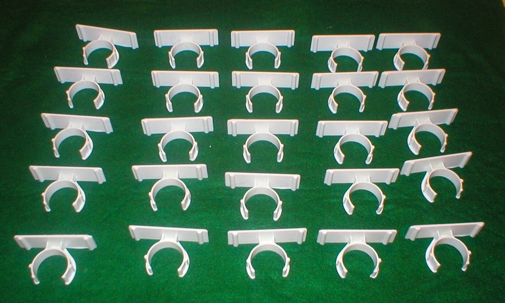 25 WHITE PLASTIC HOLDERS WITH ADHESIVE STRIPS LOT SOLD AS IS