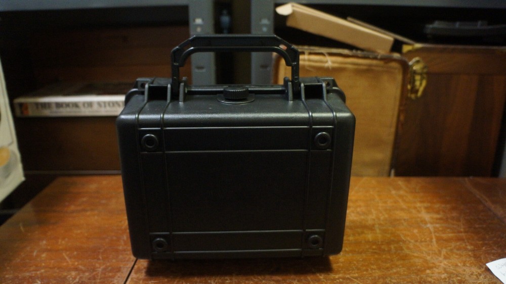 NICE BLACK HARD PLASTIC BOX WITH 20 GRADED COIN SLOTS--DOESNT LOCK TABS SECURE