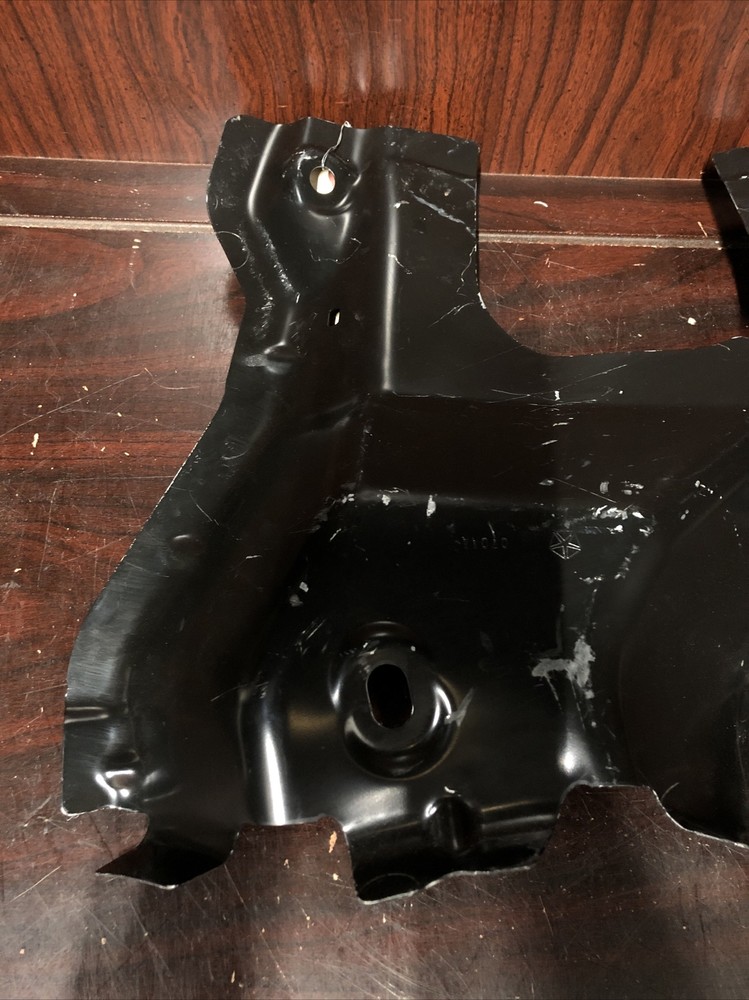 New Old Stock Unbranded Back Panel Bracket Part #68244050AA.