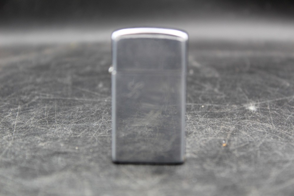 Zippo Lighter 2-1/4” X 1-1/8”.