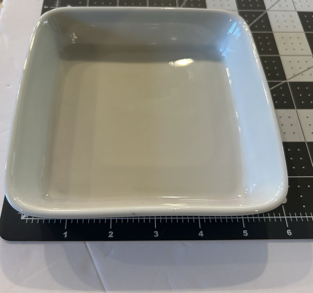 Pre-owned Dansk 6” square white ceramic baking dish.