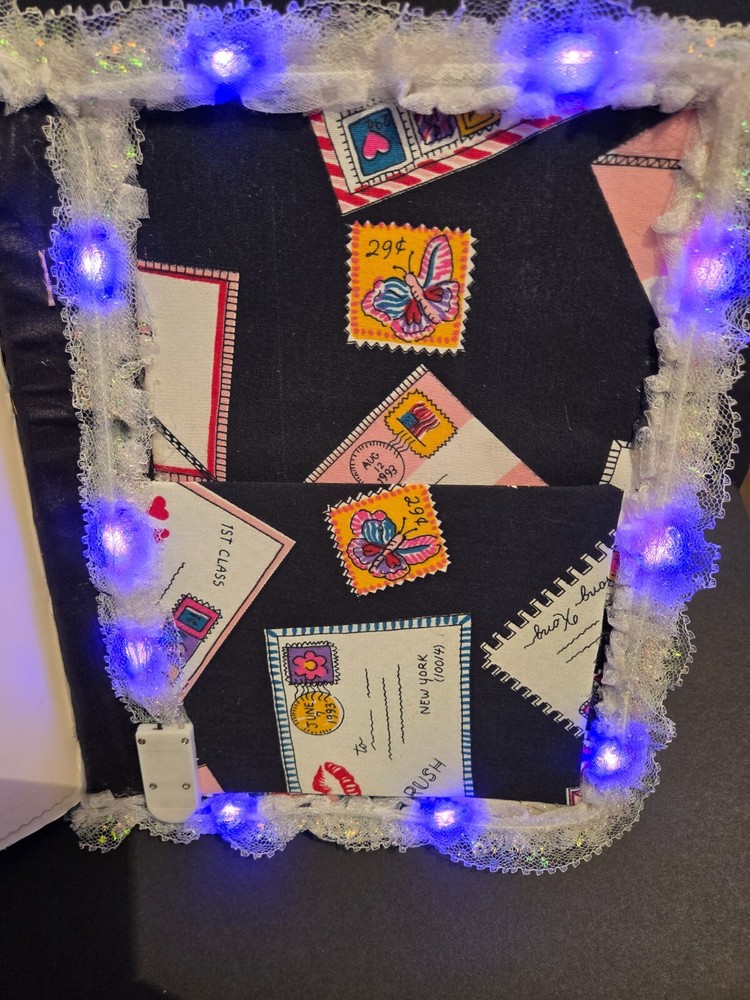 Junk journal with dragon front and back with lights inside. Pockets/tags too.