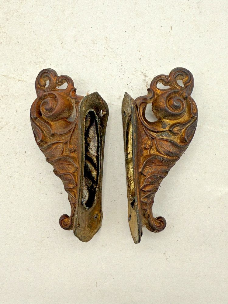 2 Antique Cast Ornaments From a Ingraham Clock. (CM92-0975)