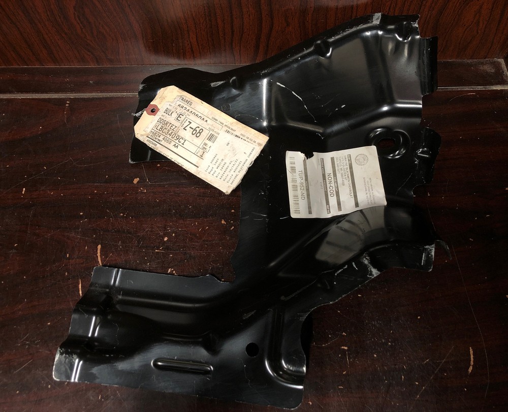 New Old Stock Unbranded Back Panel Bracket Part #68244050AA.