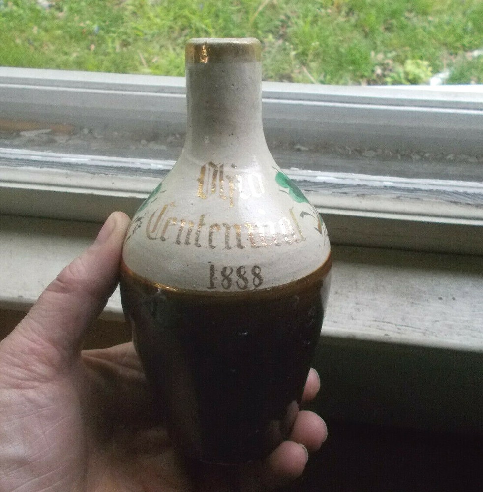 1888 DATED OHIO CENTENNIAL STONEWARE BOTTLE HAND PAINTED FLOWERS HANDLE BROKEN
