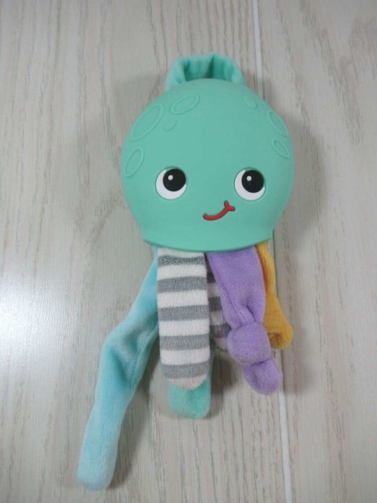 Silli Chews green octopus teether plush multi-colored legs tentacles gray stripe