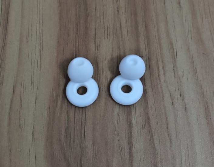 White loop shaped noise reducing sleep aid earplugs w/extra buds SILICONE