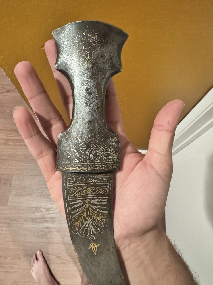 antique dagger with gold and silver engravings