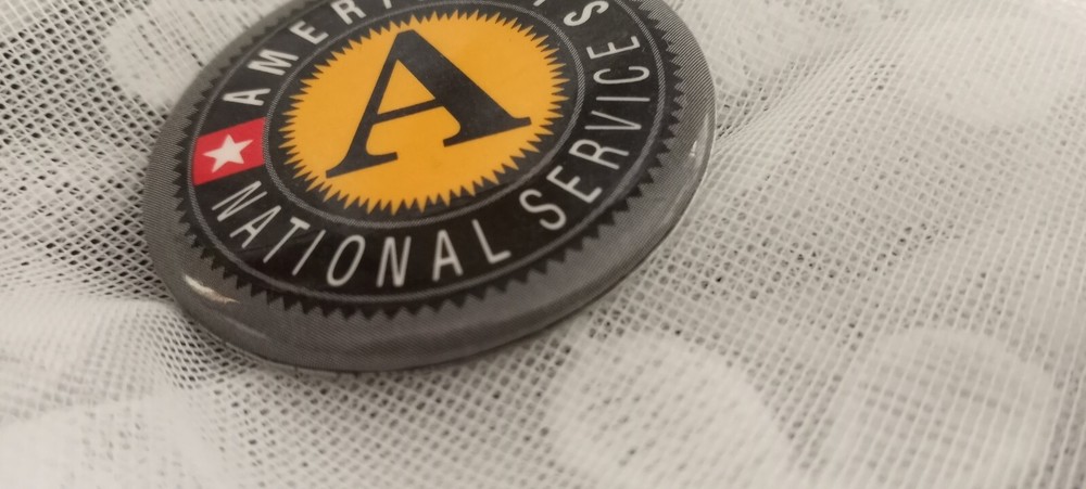 Americorps Pin National Service Black Background