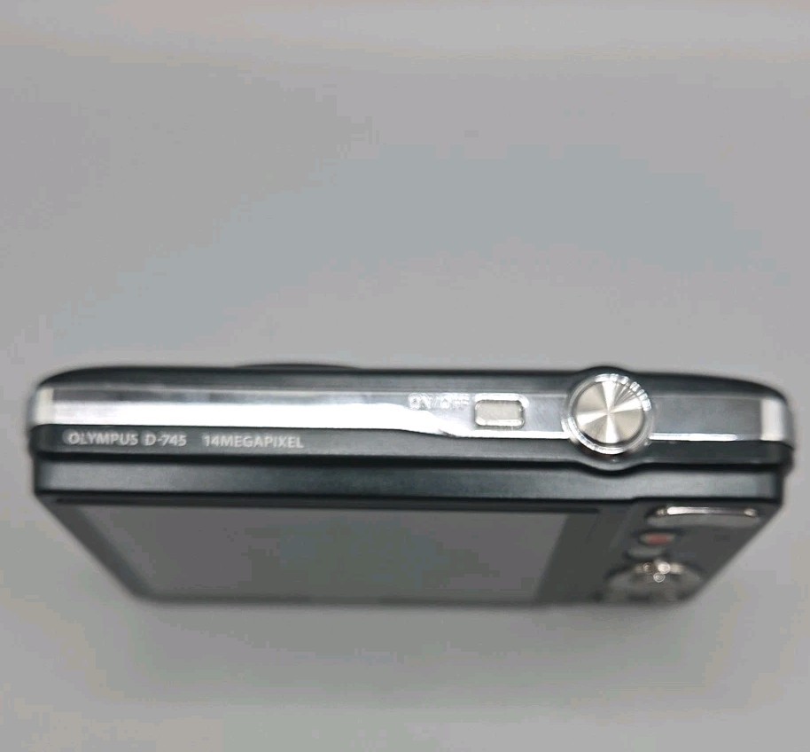 Olympus D-745 Digital Camera And Charging Lead, Black.