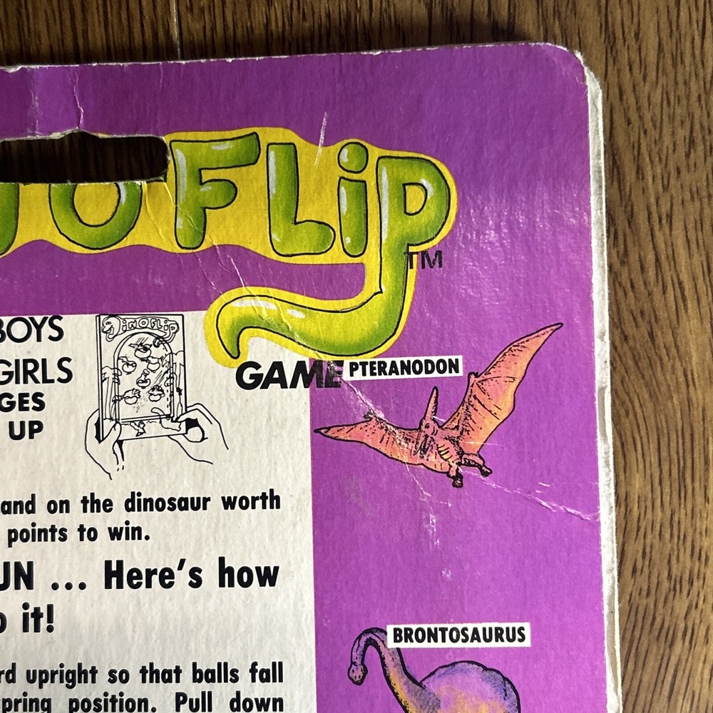 Vintage 1987 Din-o-Flip Handheld Game.