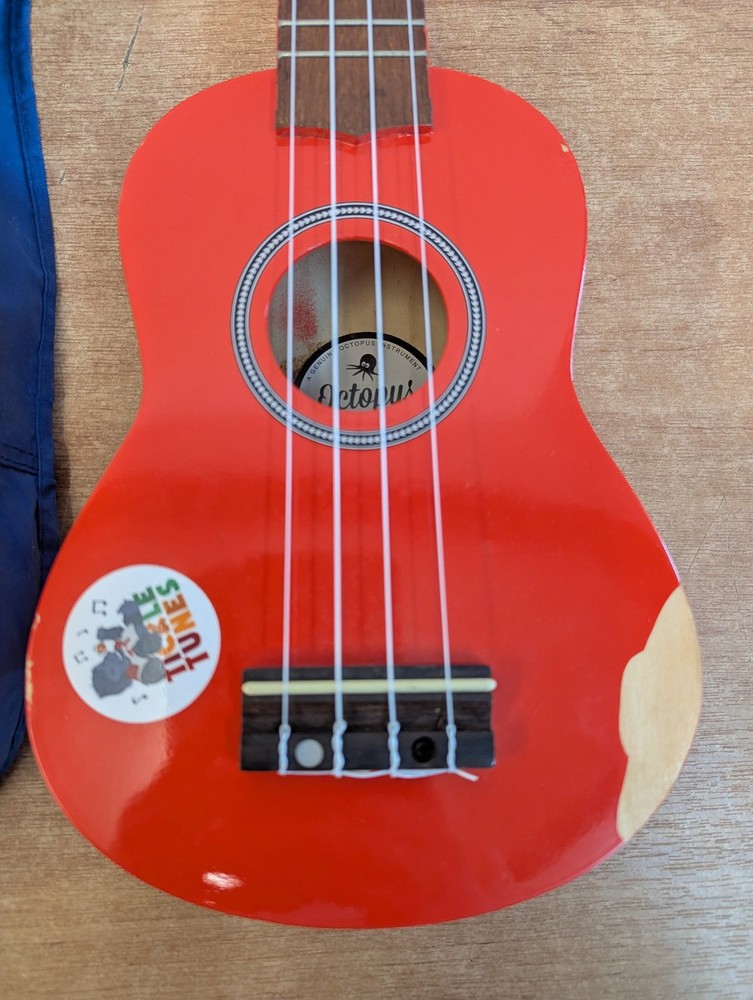 Octopus Soprano Ukulele Red with 4 Strings Includes Case for Beginners