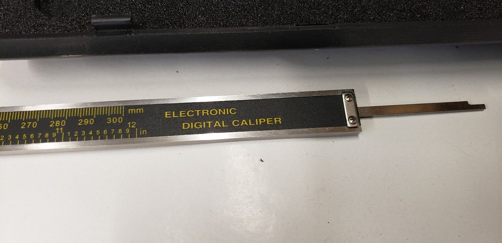 2-Piece Imported 0 -12" Electronic & Dial Calipers in Boxes. Both Working.