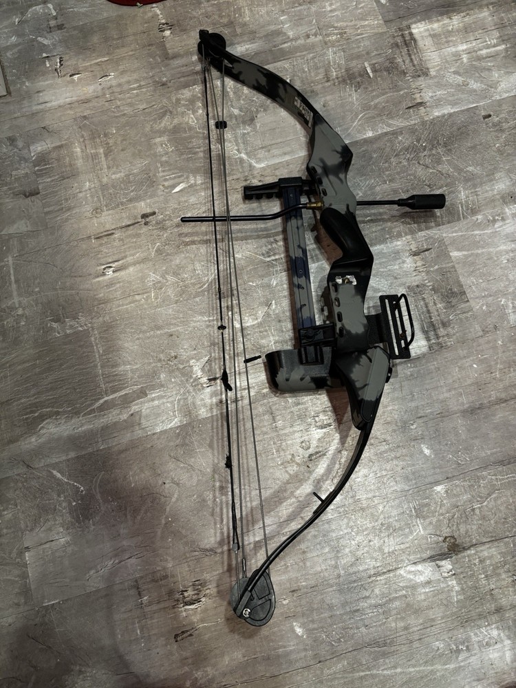 This item is a PSE Polaris Express bow riser, featuring a camouflage design.