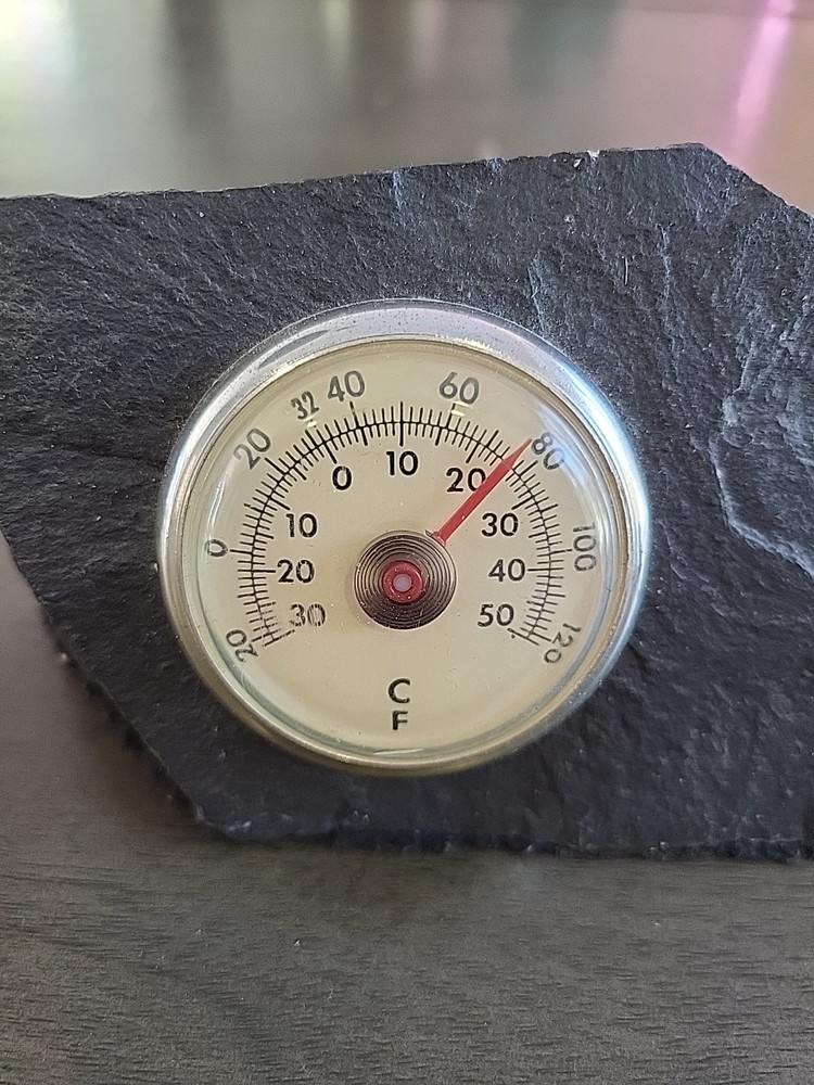 Vintage Desktop Thermometer on Jagged Stone.