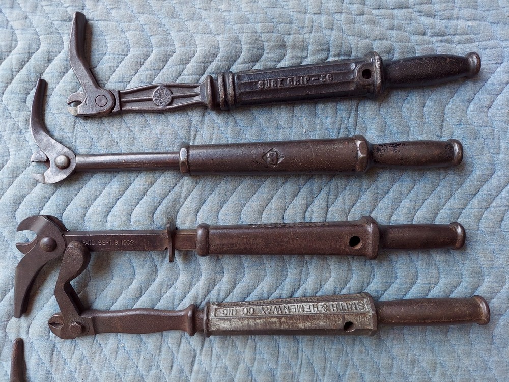 Collection of 8 different antique nail pullers