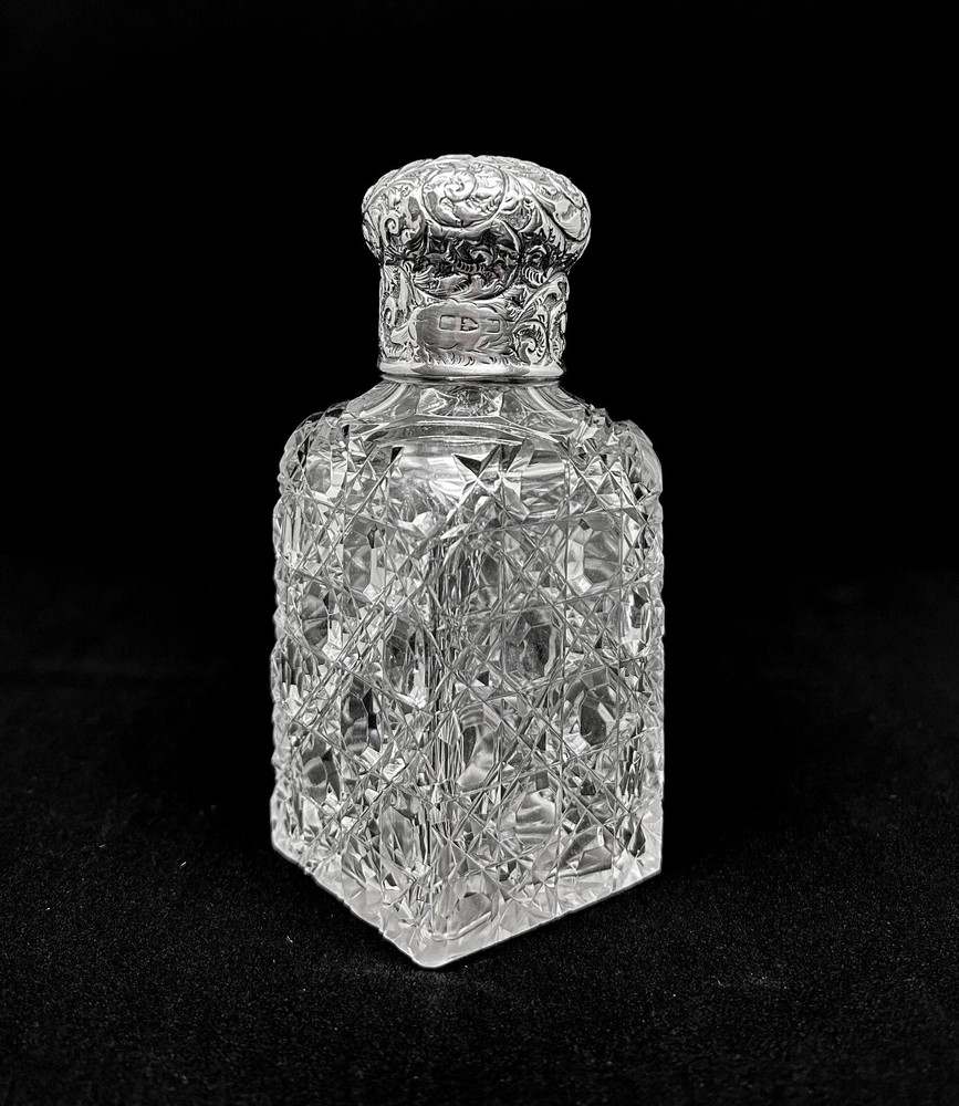 Edwardian sterling silver topped perfume bottle