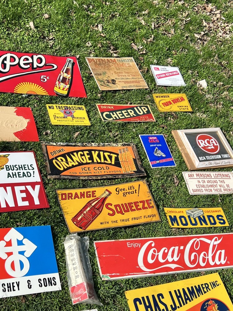 Feeds Cow Pass 500 Feet Embossed Tin Sign
