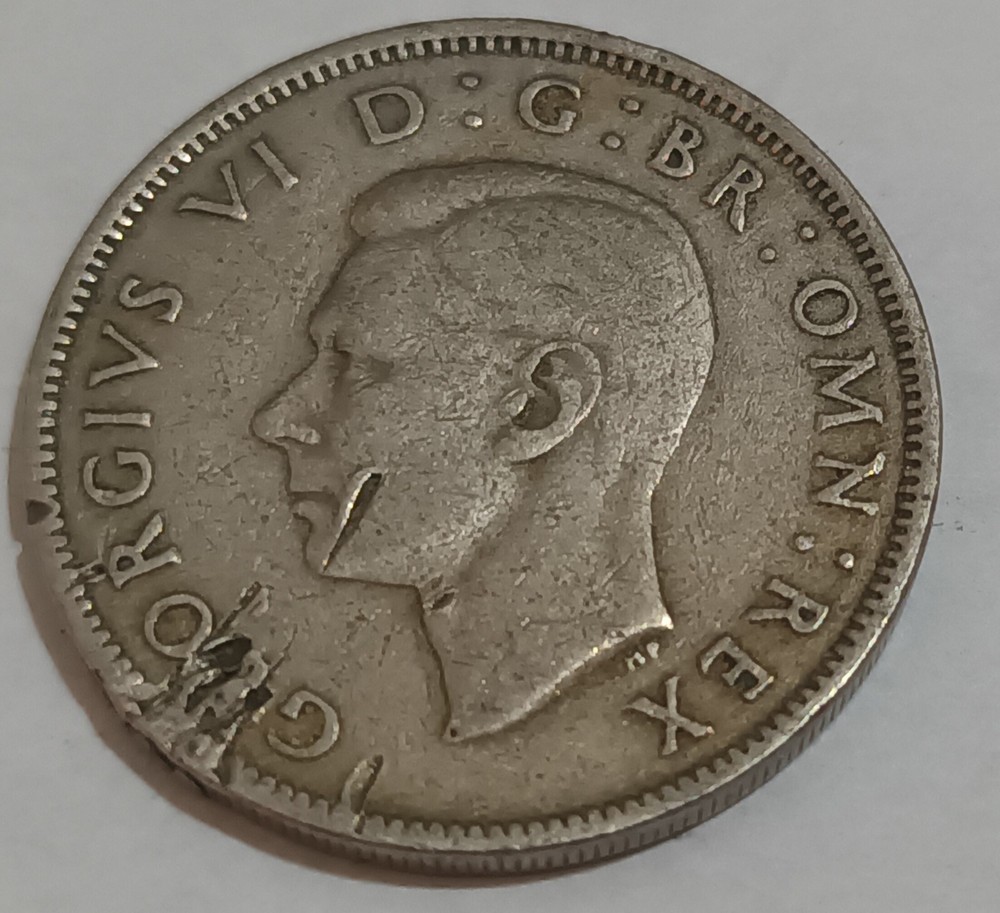 George V and George VI coins with error
