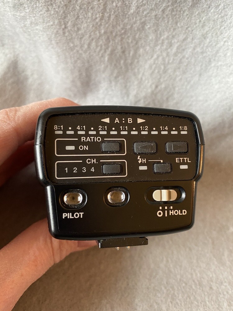 Canon Speedlite Transmitter ST-E2 And Book