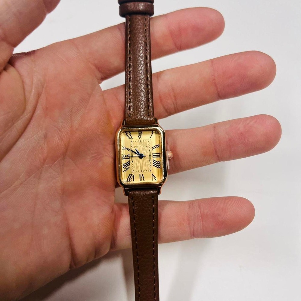 2000s vintage style rectangular gold luxury watch with leather band
