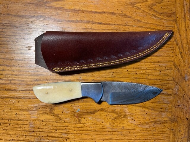 Nice Damascus deep belly caper with white bone stocks & leather sheath