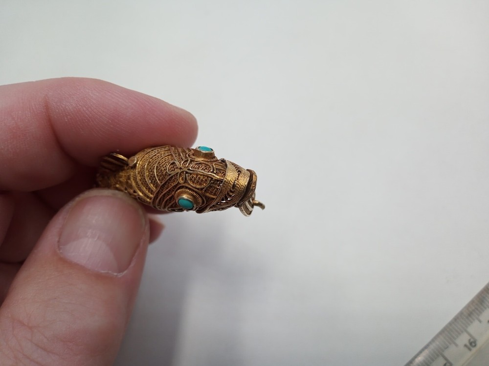 Tested as silver and gilded flexible fish, possibly pill box.