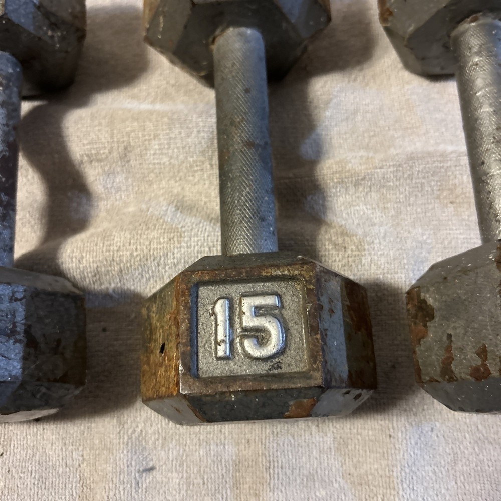 Three 15 Pound hex Head Cast Iron Dumbbells Silver