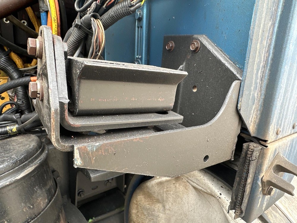 International 9900 Left/Driver Hood Rest - Used
