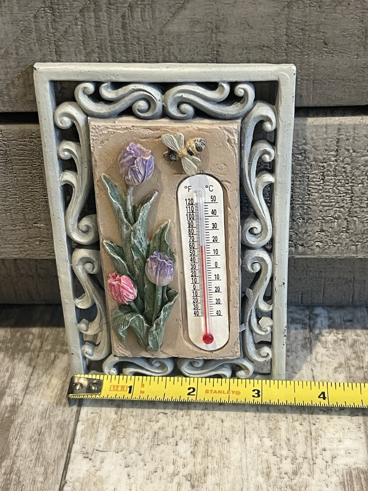 vintage relief wall thermometer