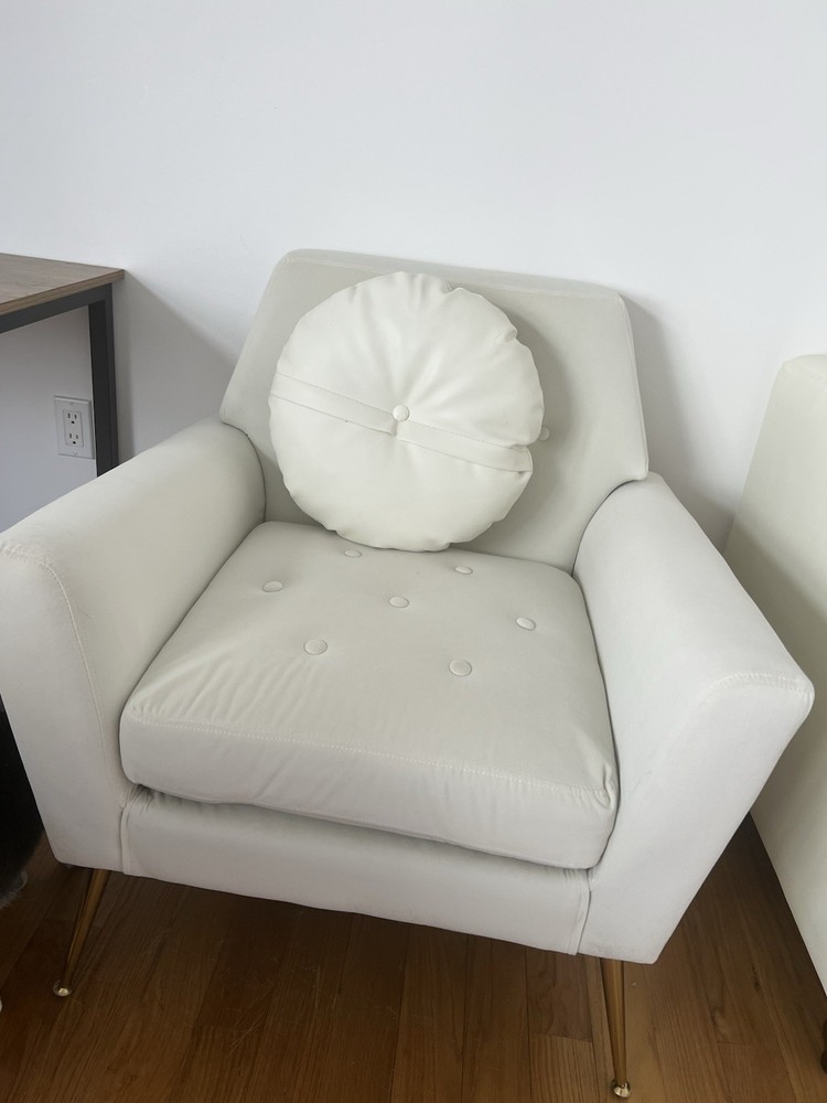 White quilted fabric armchair