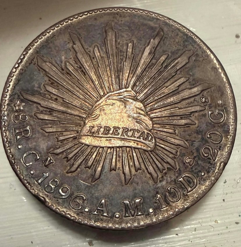 1896 8 Reals Cap & Rays coin