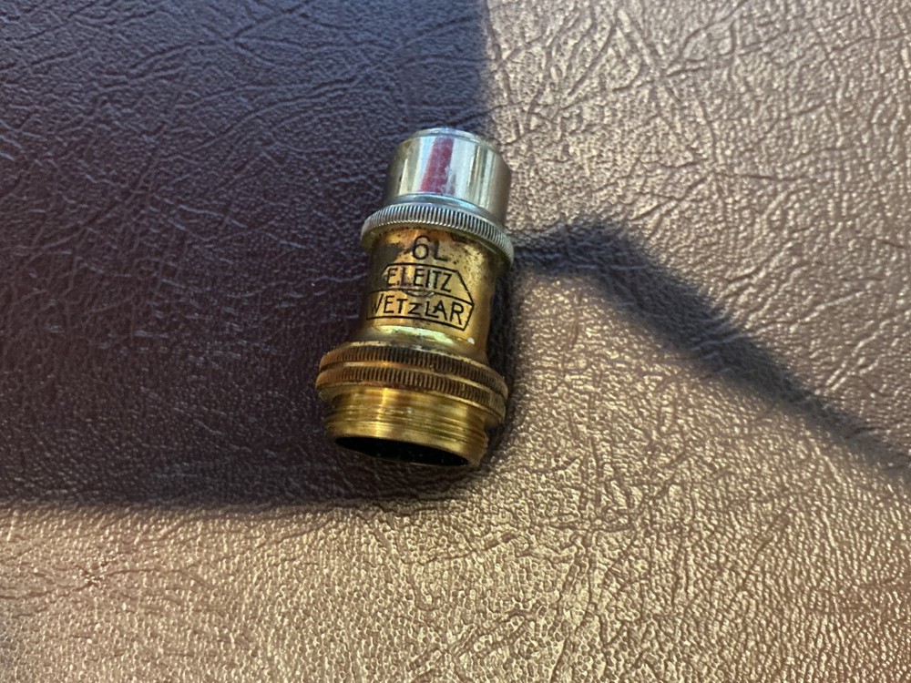 ERNST LEITZ MICROSCOPE WITH 3 OBJECTIVES AND CASE.