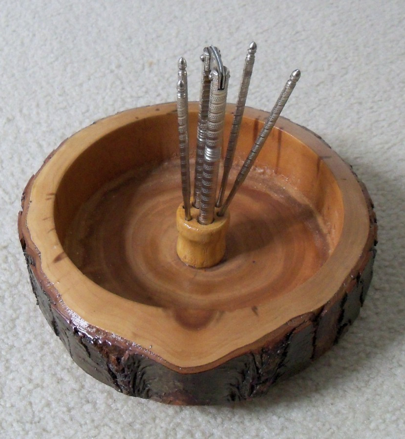 Round wood nut holder bowl with nutcracker and picks